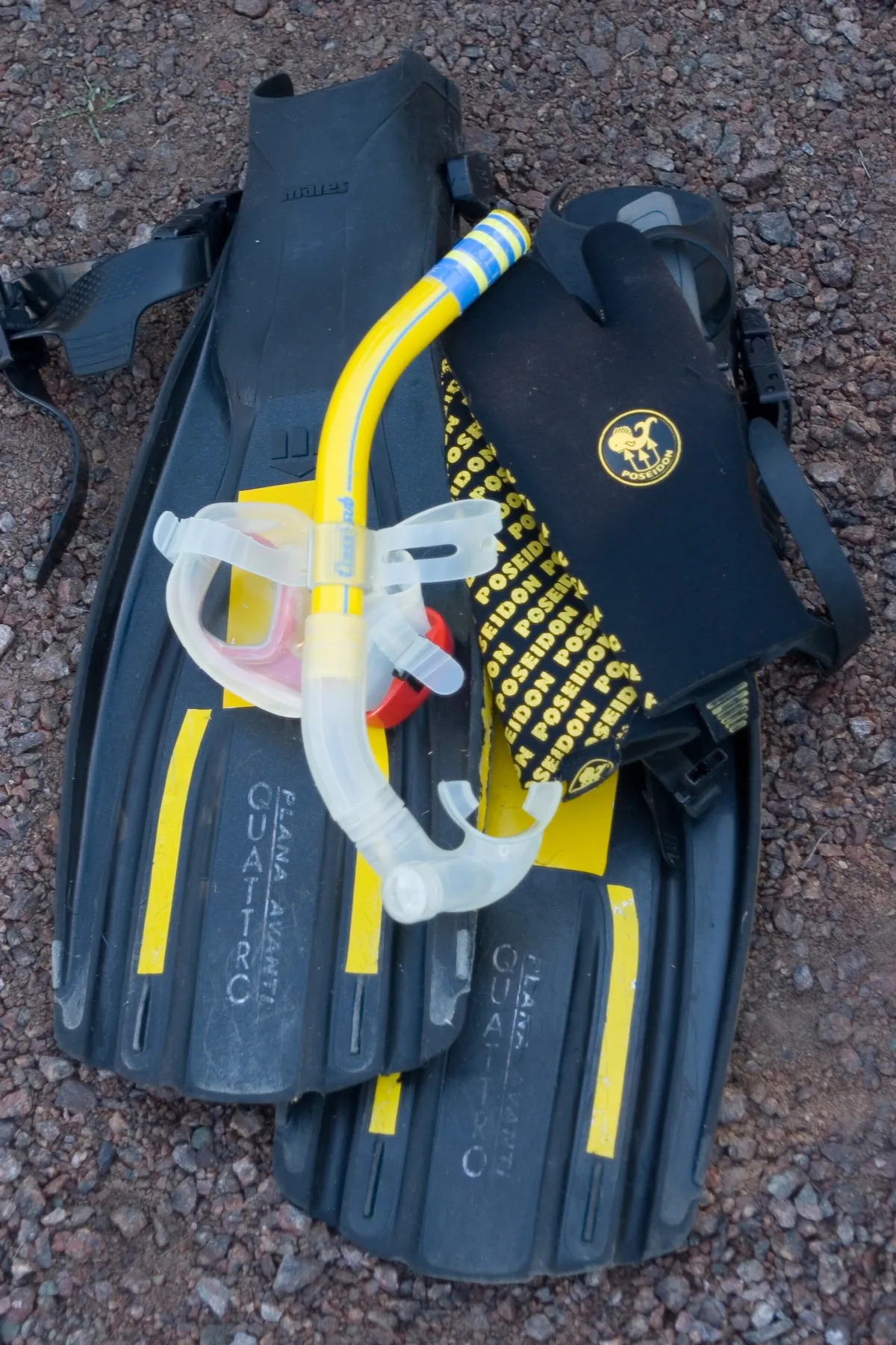 Snorkelling set of mask, snorkel and fins laid out ready for a boat trip